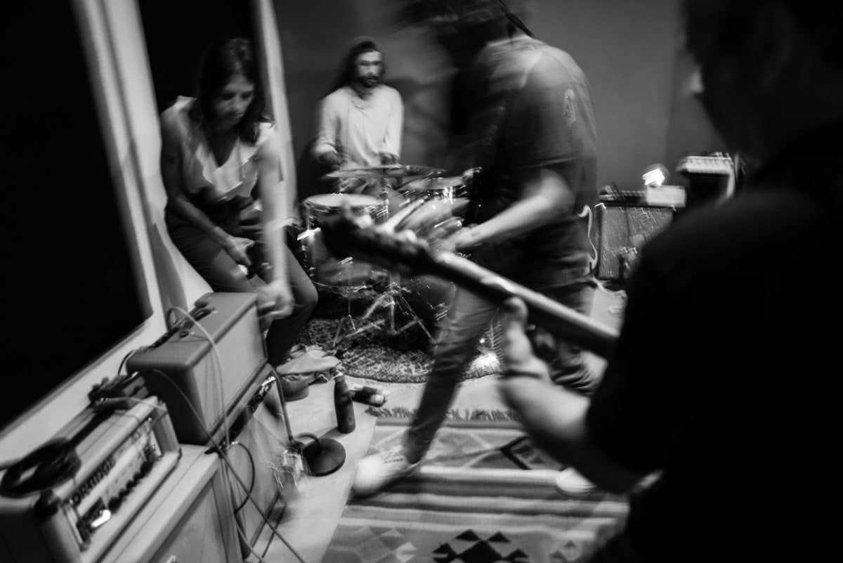 a group of people playing music in a room
