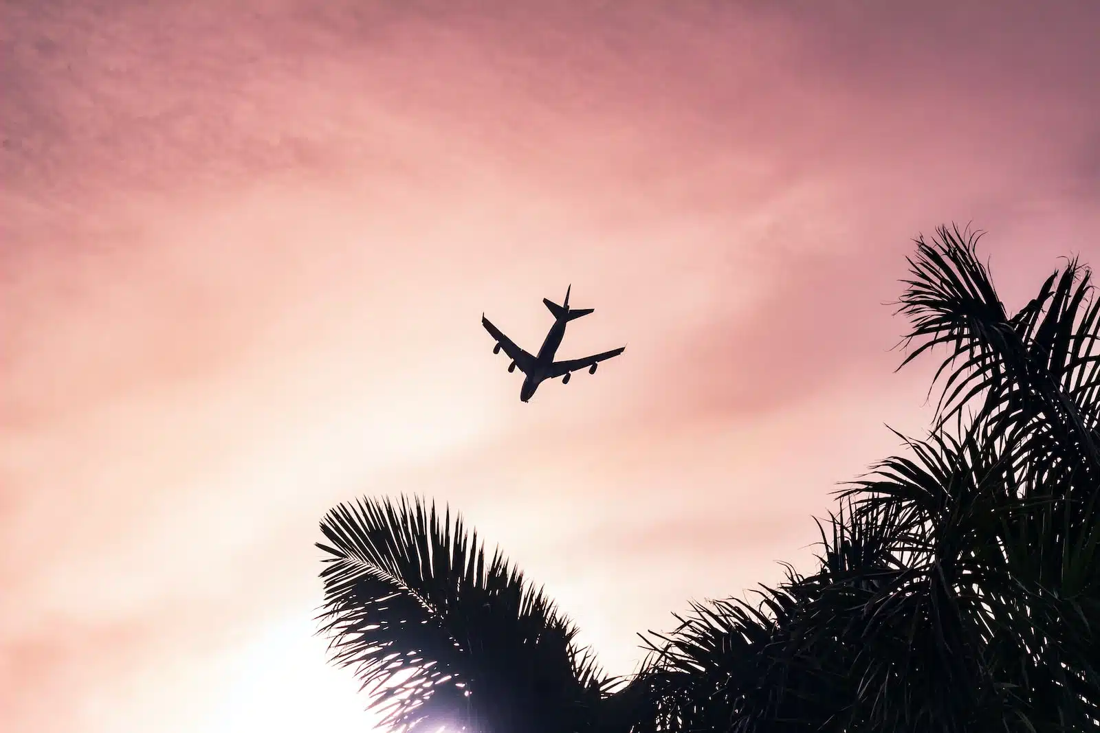 airplane under cloudy sky during daytime